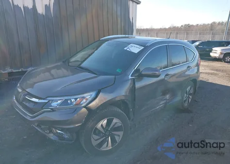 2015 Honda Cr-V Touring z USA, uszkodzony, nr VIN 5J6RM4H90FL090130